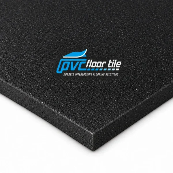 Heavy-Duty Rubber Gym Mats – Black Gym Flooring Black heavy-duty rubber gym mats with a dense granular textured surface and thick square edges