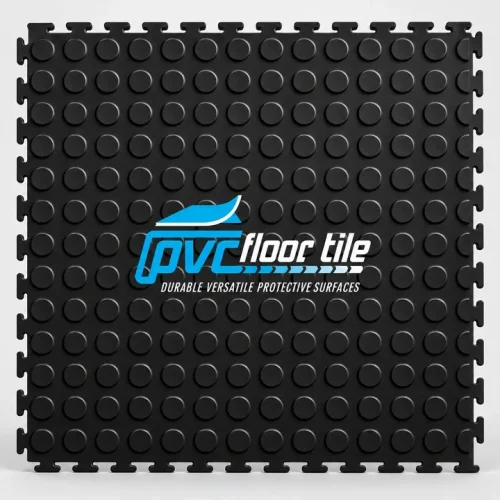 Black rubber mats gym flooring tile with raised circular coin pattern and visible interlocking edges