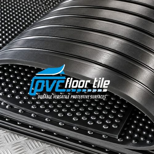 Black Horse Rubber Mats with raised ribbed surface and circular stud texture, shown partially rolled back