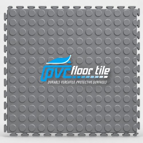 Grey commercial flooring tiles with raised circular coin pattern and visible interlocking edges