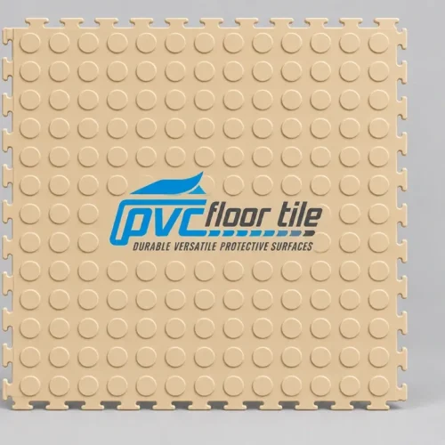 Beige rubber interlocking tiles with raised circular grip pattern and interlocking edges for modular flooring
