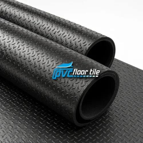 Black Rice Rubber Roll flooring with raised rice-grain tread pattern, showing two partially rolled rubber mats