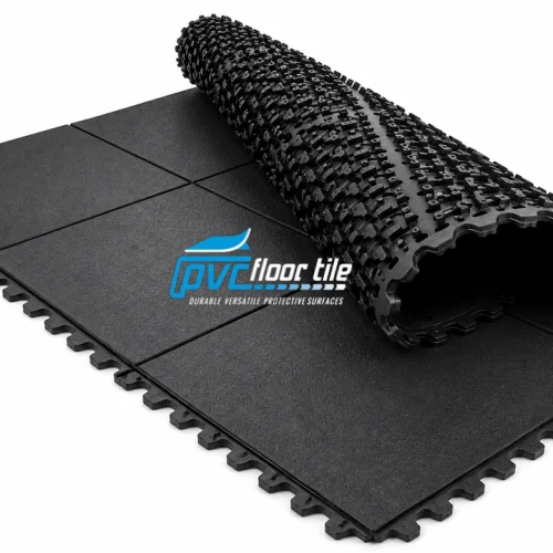 Black Rubber Modular Mat with interlocking puzzle edges, showing flat flooring panels and a partially rolled textured mat